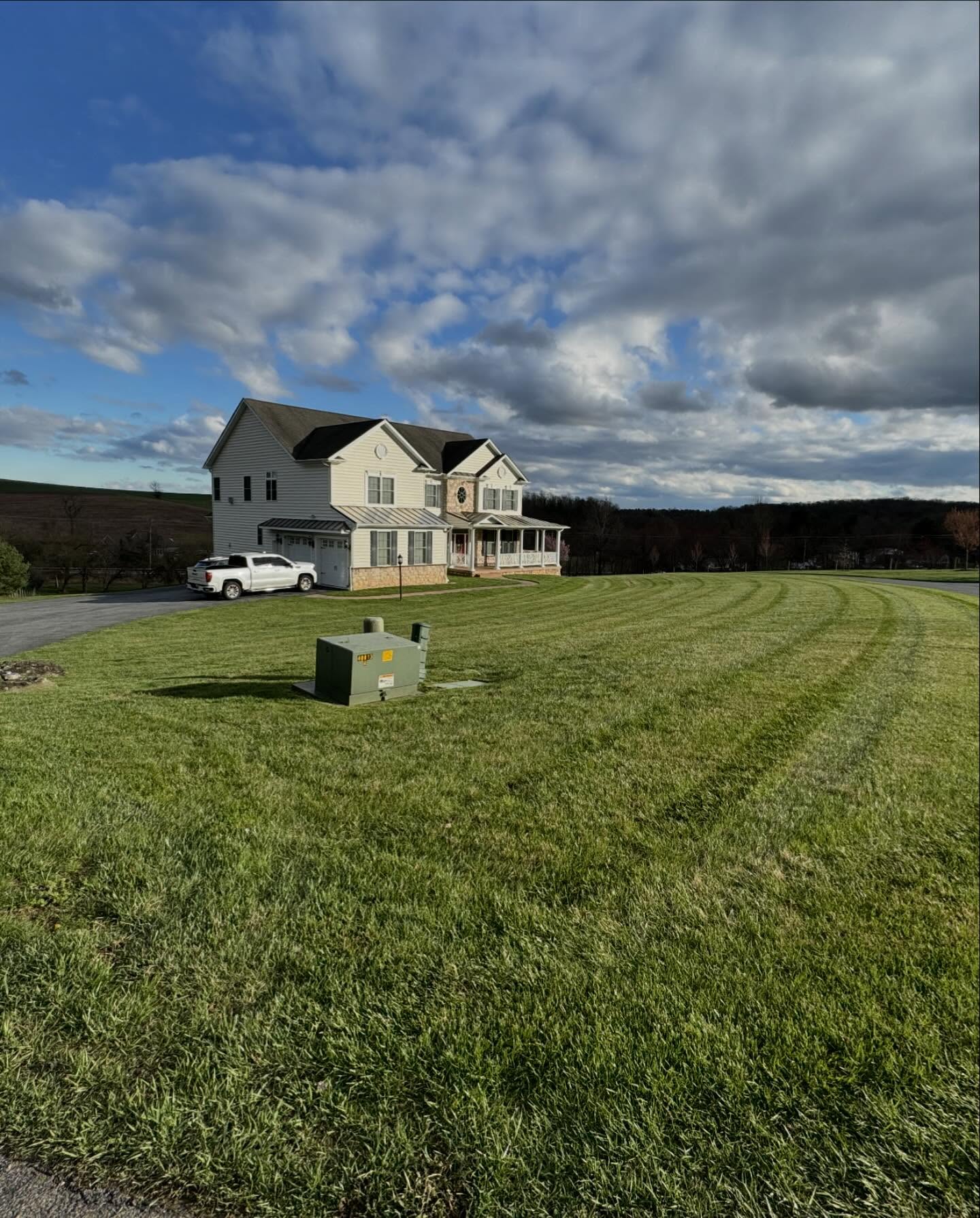 Residential home with professionally striped mowing pattern on the front lawn